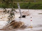 Police are urging Queenslanders not to drive through floodwaters after five people were rescued. (JASON O?BRIEN/AAP PHOTOS)