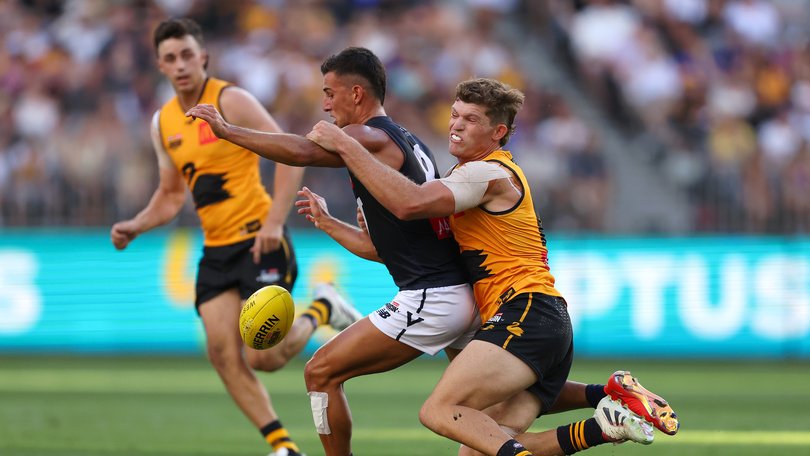 Mitch Georgiades of Western Australia tackles Nick Daicos.