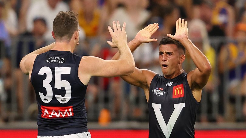 Patrick Dangerfield and Nick Daicos of Victoria celebrate a goal.