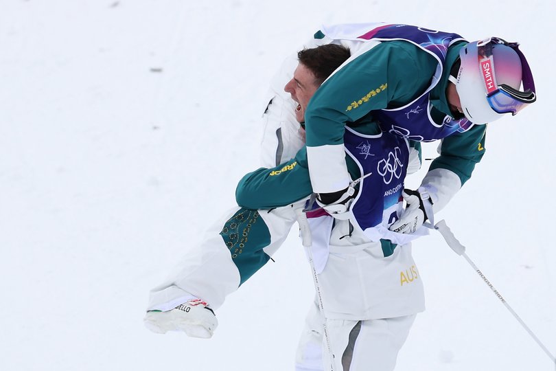 Gold medalist Cooper Woods of Team Australia celebrates with team mate Matt Graham.