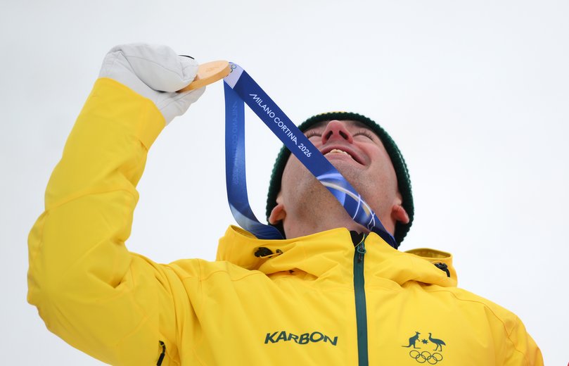 Gold medalist Cooper Woods of Team Australia celebrates on the podium after the Men's Freestyle Skiing Moguls Final 2 on day six of the Milano Cortina 2026 Winter Olympic games at Livigno Air Park on February 12, 2026 in Livigno, Italy. (Photo by David Ramos/Getty Images)