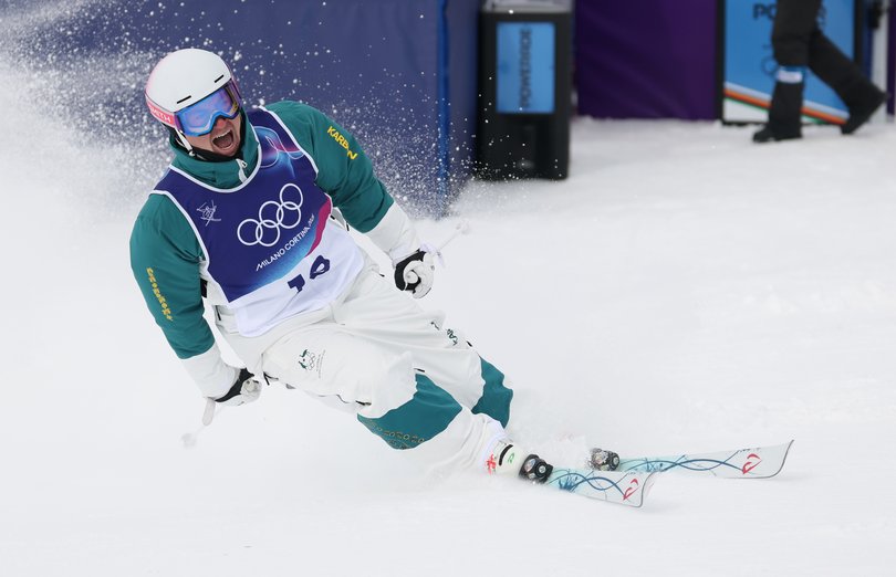 Gold medalist Cooper Woods of Team Australia reacts after winning the Men's Freestyle Skiing Moguls Final 2.