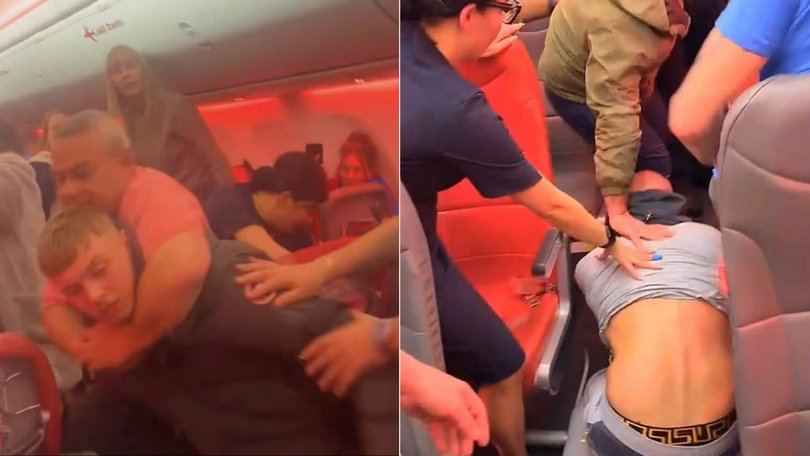 A flight home descended into chaos after an alleged racist tirade sparked a violent confrontation in the aisle.