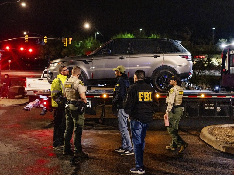 A gray Range Rover is towed from the parking lot of a Culver’s after deputies and FBI investigators searched it inside and out, in Tucson, Ariz. on Friday Feb. 13, 2026. It was unclear if the activity was related to the Guthrie case. (Cassidy Araiza/The New York Times)