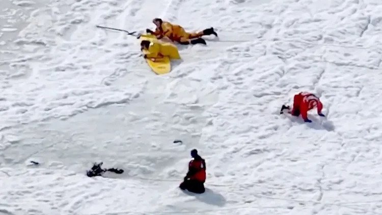 Members of the Eastham Police and Fire Departments search Bee’s River at First Encounter Beach in Massachusetts.