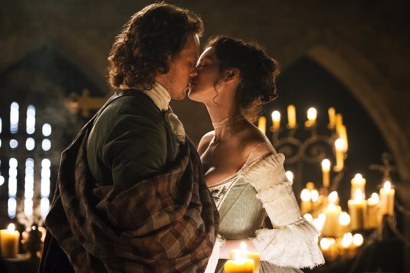 Catriona Balfe and Sam Heughan in Outlander.