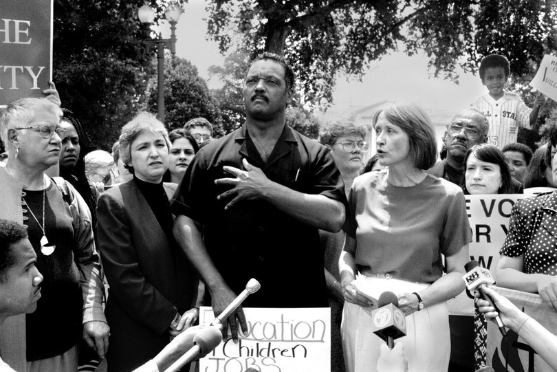 Rev. Jackson and others protest outside the White House against President Bill Clinton's announcement that he would sign a welfare-reform bill in 1996. MUST CREDIT: Larry Morris/The Washington Post