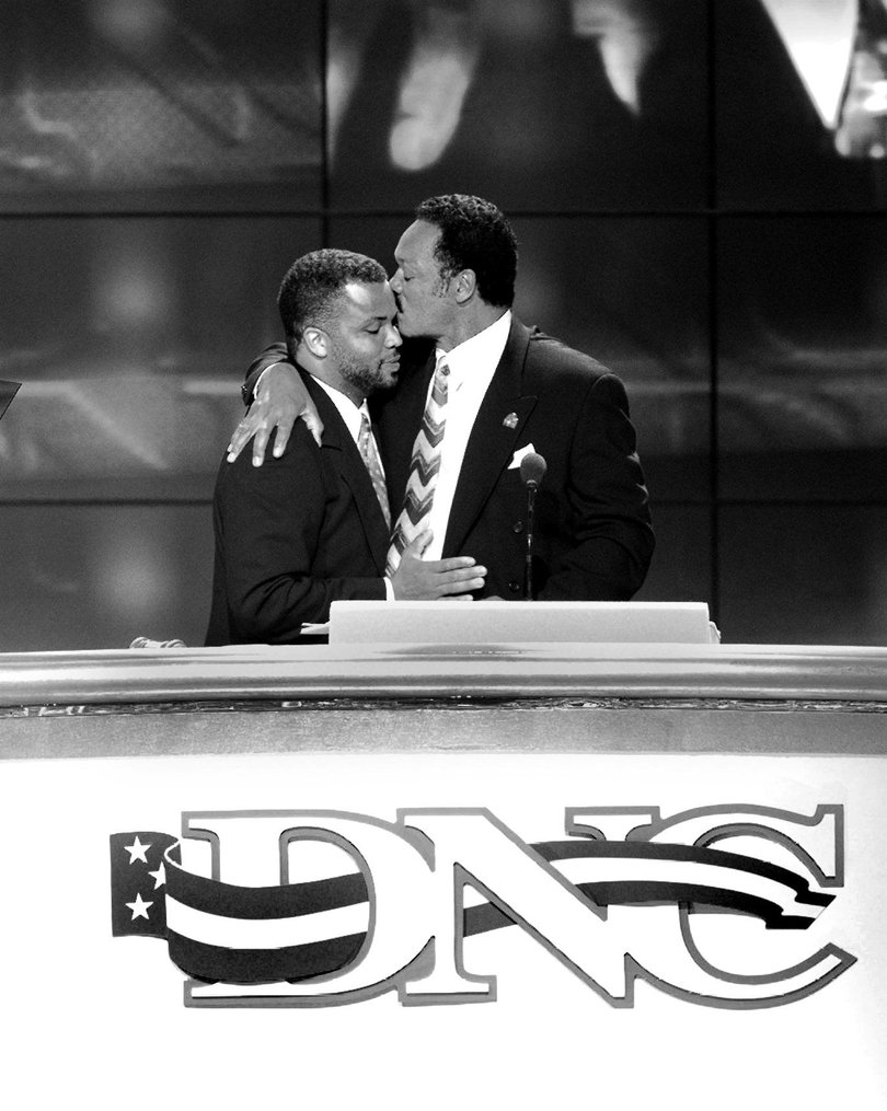 Rev. Jackson kisses his son Rep. Jesse Jackson Jr. at the Democratic National Convention in Chicago in 1996. MUST CREDIT: Keith Jenkins/The Washington Post