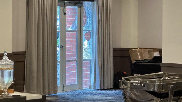 A smashed window at Hyatt Hotel Canberra, the venue for the ADM Congress. 