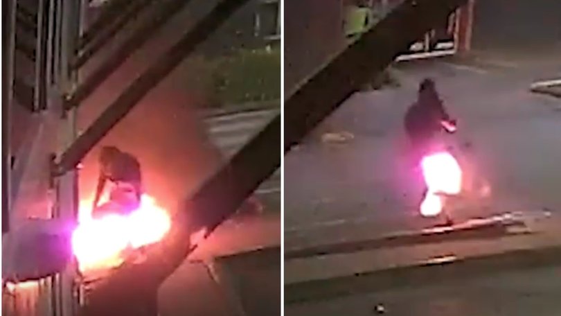 Bizarre CCTV footage shows the moment an alleged thief flees a crime scene after accidentally setting himself on fire.