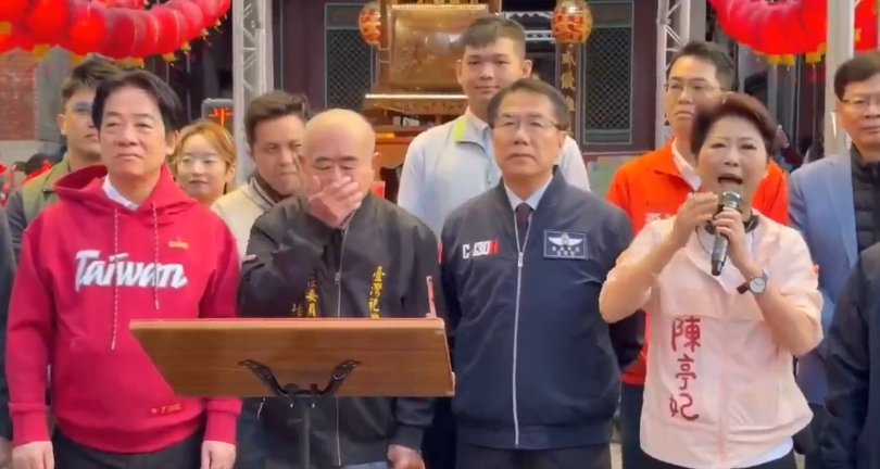The foul footage shows the unaware leader cop a mouthful during official Lunar New Year celebrations.