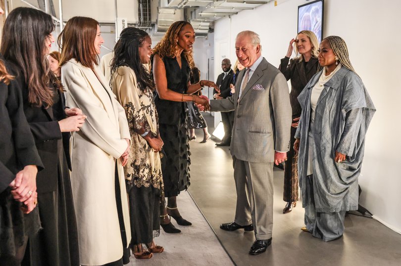 King Charles III talks with young British fashion designers (Photo by Richard Pohle - WPA Pool/Getty Images)
