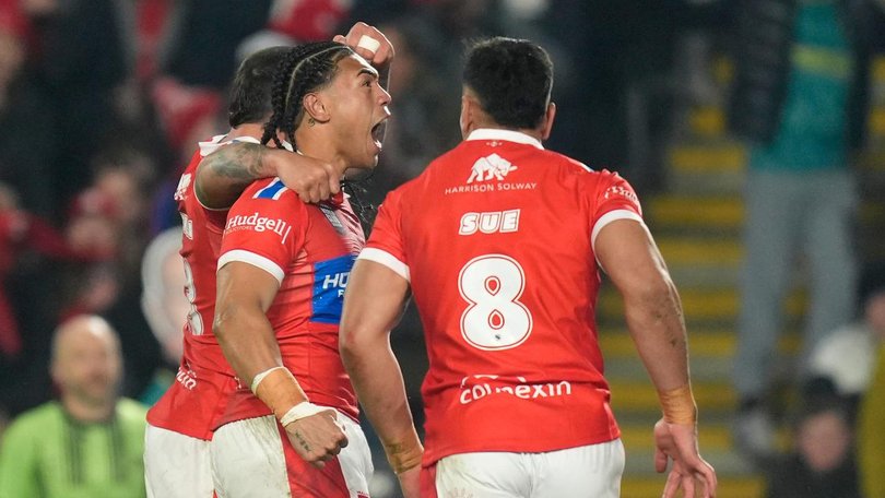 Hull KR forward Tom Amone celebrates his team's opening try in the World Club Challenge. 
