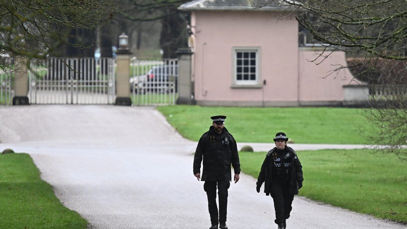 Police Officers patrol near the gates of the Royal Lodge, Andrew Mountbatten-Windsor's former residence in Windsor