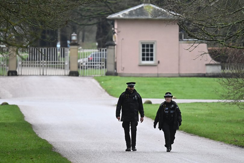 Police Officers patrol near the gates of the Royal Lodge, Andrew Mountbatten-Windsor's former residence in Windsor Great Park.
