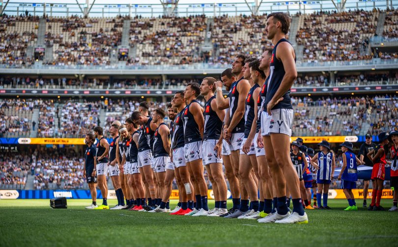 The Victorian team line up during the 2026 AFL Origin match between Western Australia and Victoria at Optus Stadium.