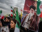 Thousands march carrying the national flag of the Islamic Republic of Iran and posters of Ayatollah Ali Khamenei to commemorate the 47th anniversary of the Islamic Revolution, in Tehran on Feb. 11, 2026.