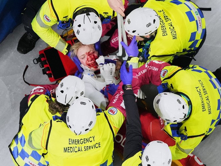 Kamila Sellier receives medical attention after having her head sliced open.