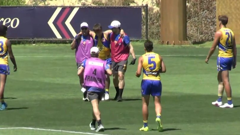 Noah Long is helped from the field.