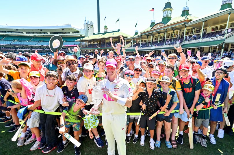 Steve Smith of Australia poses for a photo with the Ashes Trophy and the fans.
