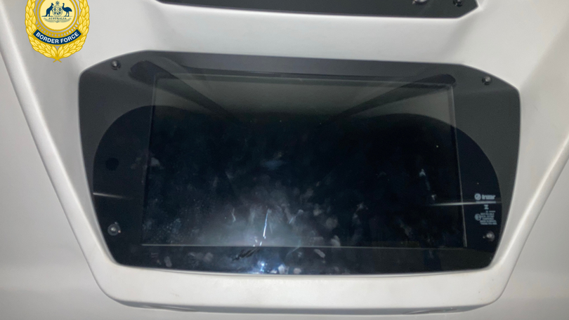 Several 1kg packages of white powder hidden behind a television inside the minibus.