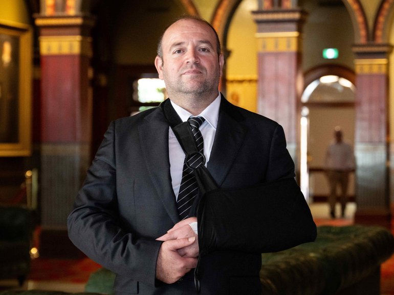 Ahmed Al Ahmed poses for a photo in NSW Parliament today after attending Question Time. 
