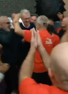 Jamal Rifi hugs Tony Burke.