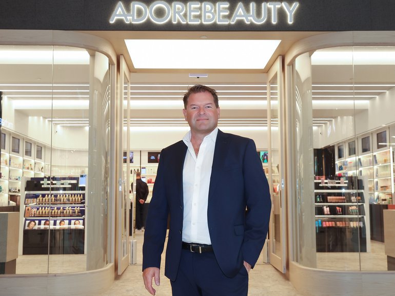 Adore Beauty chief executive Sacha Laing is sticking with its full-year guidance in hopes new store openings will attract more customers and boost sales.
