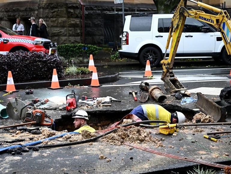 A burst water pipe is being blamed for a sinkhole which initially trapped a truck in the void. (Bianca De Marchi/AAP PHOTOS)