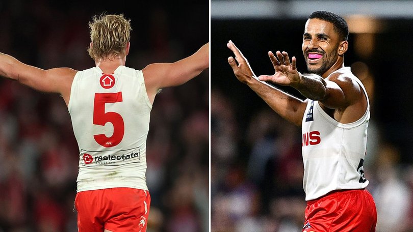 Isaac Heeny in Sydney’s heritage jumper and Touk Miller in the Suns’ white jumper on Thursday.