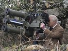 King Charles III views a lightweight multiple launcher.