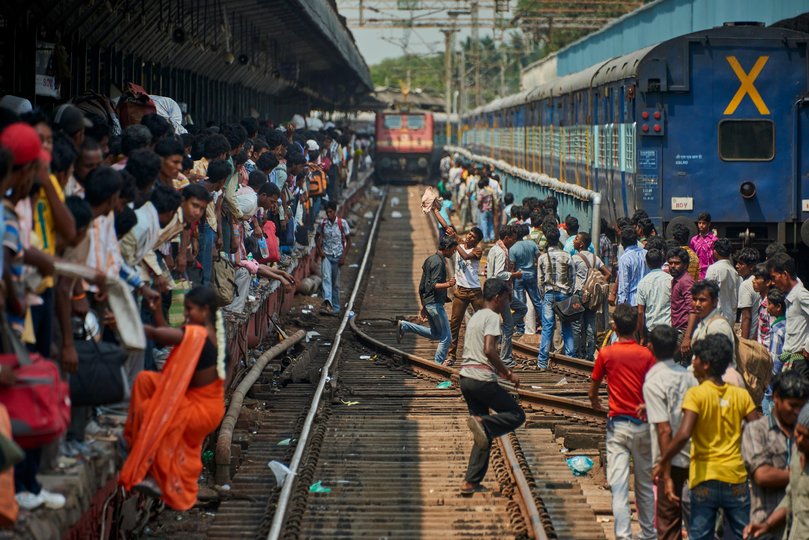 People are crowded along the track waiting for a train at the Train Station of Chennai Picture: Photo by Bernardo Ricci Armani