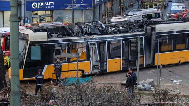 Two people have been killed ater a tram derailed and crashed into a nearby building in Milan. (EPA PHOTO)