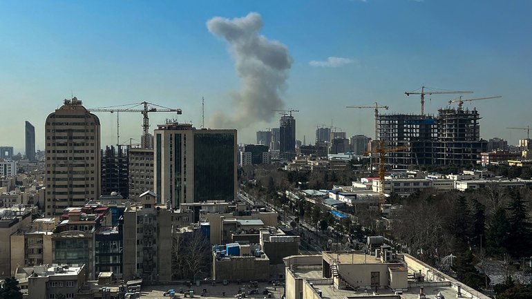 A plume of smoke rises following a reported explosion in Tehran on Saturday.