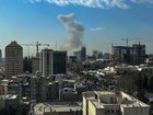 A plume of smoke rises following a reported explosion in Tehran on Saturday.