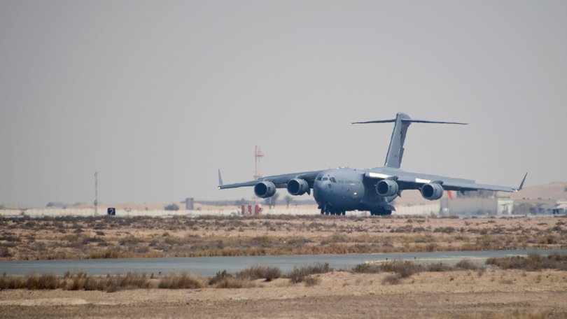 A RAAF Globemaster lands at Al Minhad with military cargo from Australia.