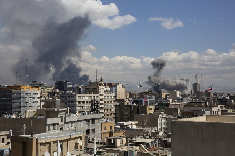 Smoke rises after coordinated US and Israeli airstrikes in Tehran, Iran.