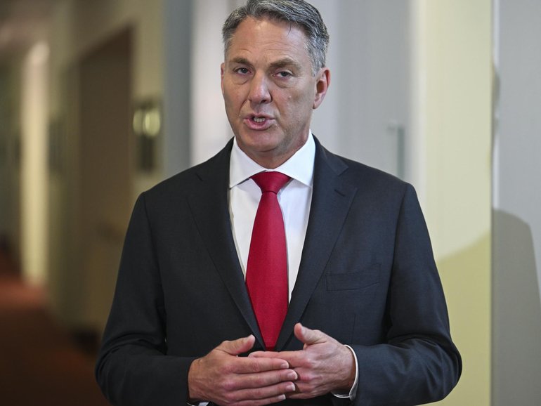 A defence base in the UAE that’s home to Australian defence force members has been hit by Iranian drone strikes, as thousands of travellers remain stuck.