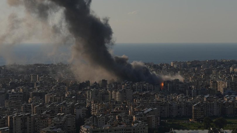 Flames and smoke rise from Israeli airstrikes on Dahiyeh, a southern suburb of Beirut.