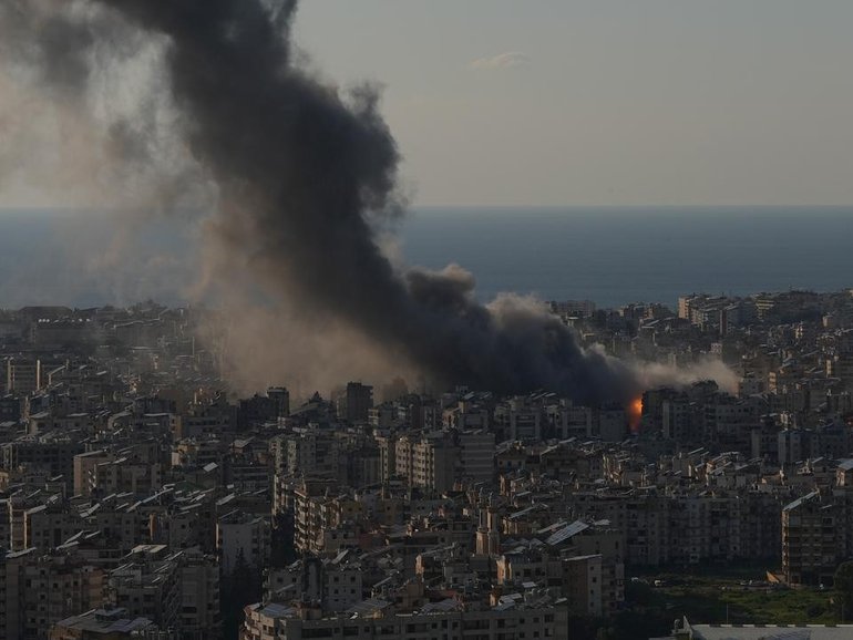 Flames and smoke rise from Israeli airstrikes on Dahiyeh, a southern suburb of Beirut.