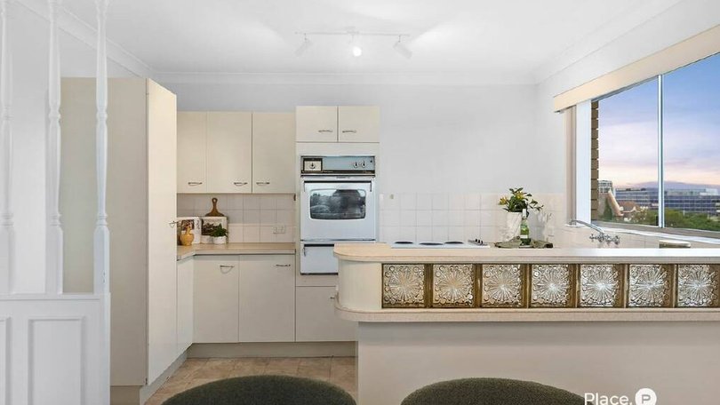 The sale of 10/24-26 Rossiter Parade, for $1,045,000, complete with 1980s style glass brick kitchenette was one of mny high octane Brisbane sales over the weekend