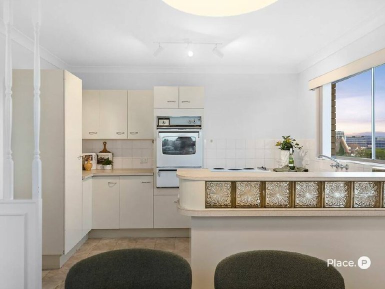 The sale of 10/24-26 Rossiter Parade, for $1,045,000, complete with 1980s style glass brick kitchenette was one of mny high octane Brisbane sales over the weekend