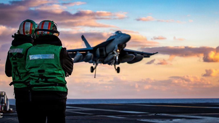 An F/A-18F Super Hornet aircraft, attached to Strike Fighter Squadron 31, lands on the flight deck of the world's largest aircraft carrier, USS Gerald R. Ford.