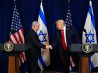 Benjamin Netanyahu and President Donald Trump shake hands during a joint news conference at Mar-a-Lago on December 29, 2025. 