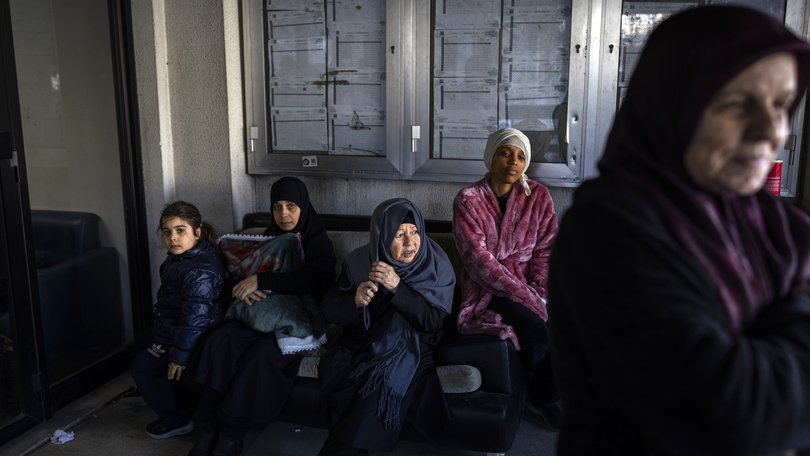 People at a school that has been turned into a shelter for the displaced in Beirut, the Lebanese capital full-blown regional war.