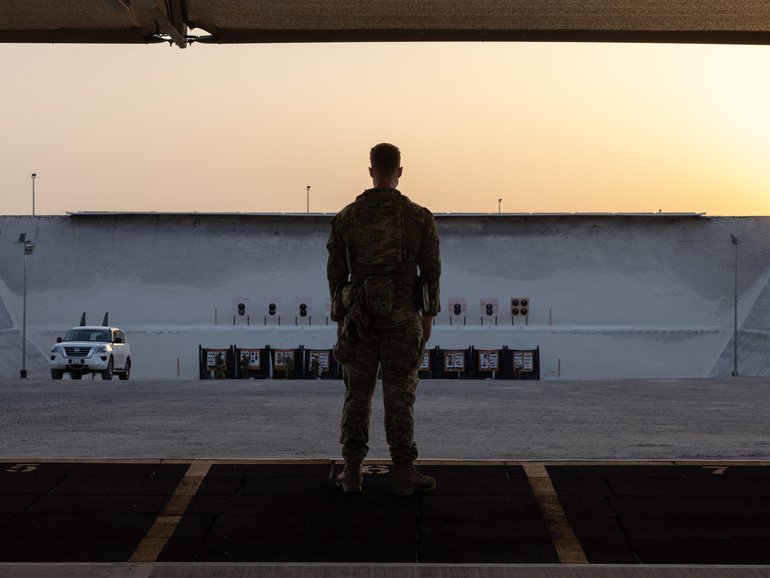 An Australian Army solder looks over the range near Headquarters Middle East, which was hit by an Iranian drone attack over the weekend.