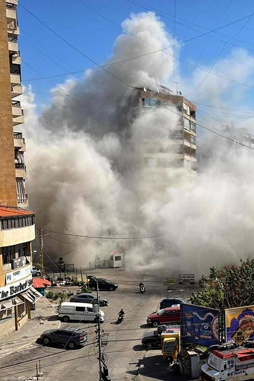 Smoke rises after an explosion from a missile strike in Dahieh, a southern suburb of Beirut.