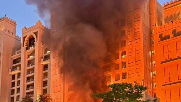 The Fairmont Hotel in Palm Jumeirah, Dubai burns after a drone strike. 