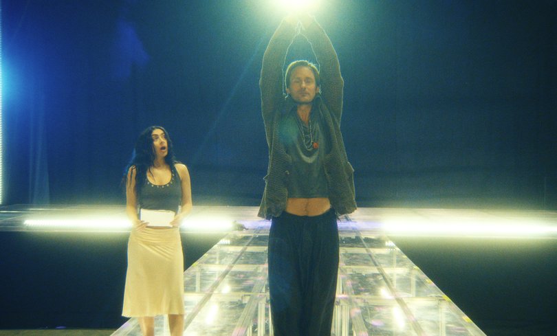 Alexander Skarsgard and Charli xcx in The Moment.