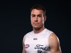 Geelong star Jeremy Cameron models the all-white jumper, which fans think have called unflattering.